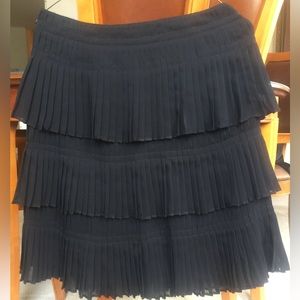 Layered levels of pleated “Chanel-like” tulle black skirt